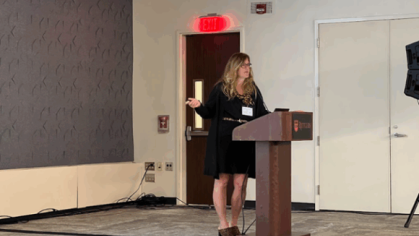 A person speaking at a podium