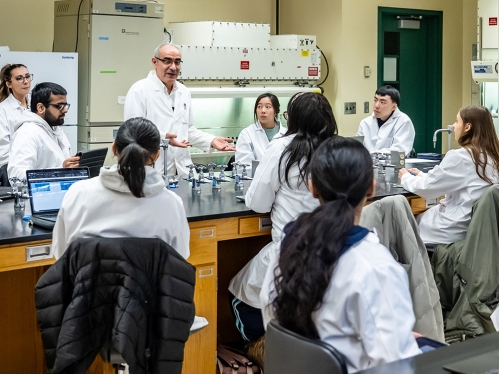 A professor teaching a class in a lab.